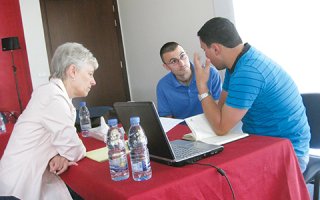 three adults studying